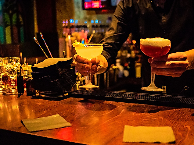 Bartender with cocktails