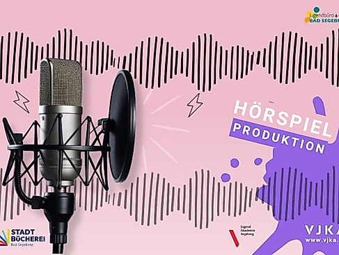 A microphone against a pink background