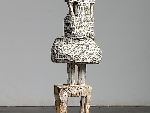 Standing figure in dress