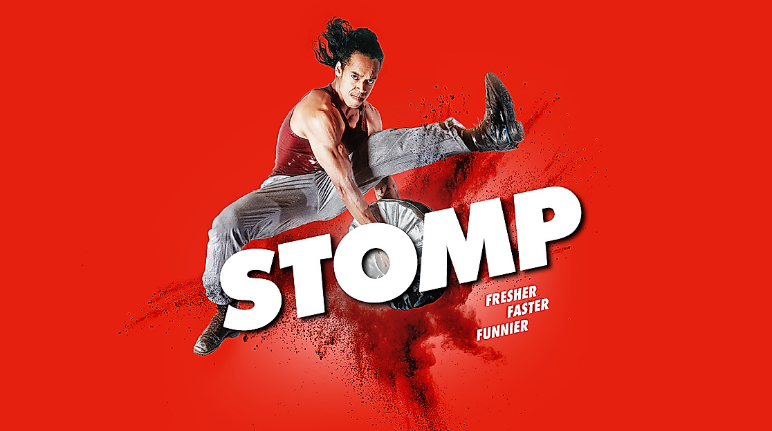 “Stomp” title sequence. A dancer jumps into the air with legs outstretched and slaps two plates together. Below him, the word ‘Stomp’ is written in capital letters, along with the tagline “Fresher, Faster, Funnier.”