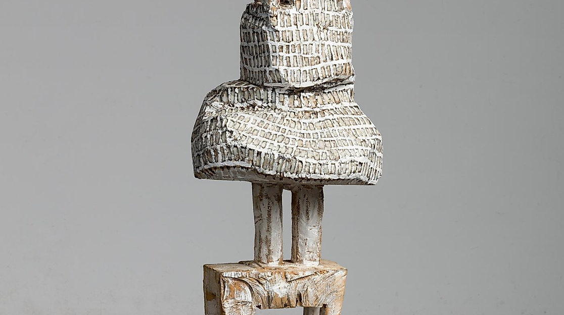 Standing figure in dress